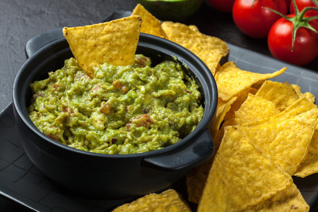 Bowl Of Guacamole With Corn Chips